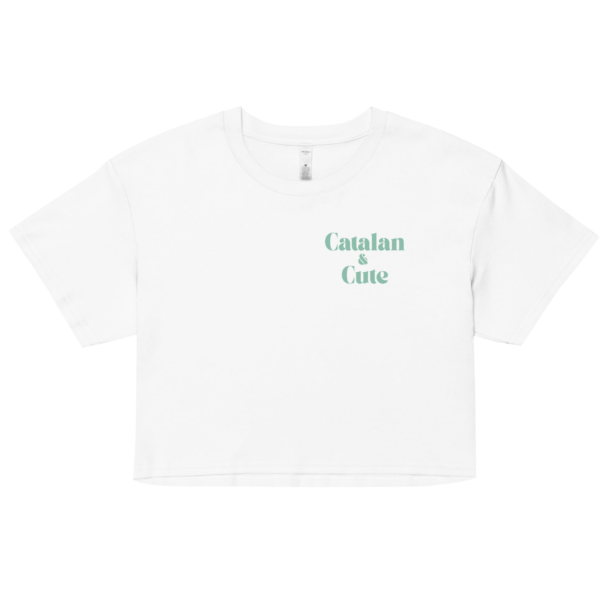 Crop top amb el text "Catalan & Cute" en tipografia arrodonida i estil minimalista, dissenyat per Catalan Words.